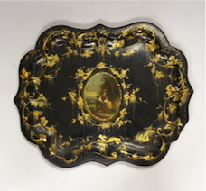 An oval 19th century papier maché gilt decorated tray, with hand painted figural cartouche, 46cm wide